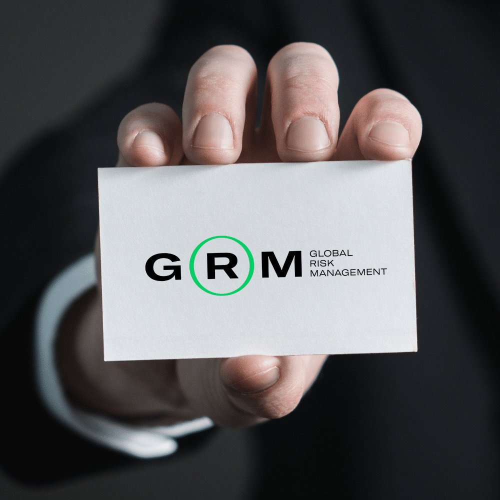 hand holding a business card