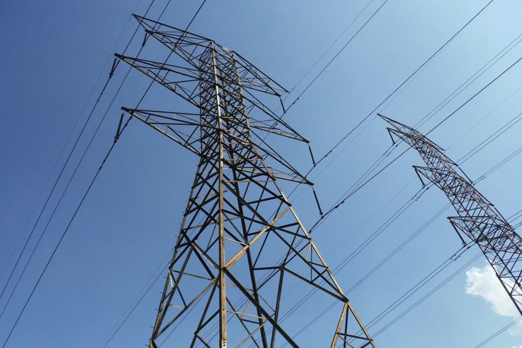 telephone pole with blue sky